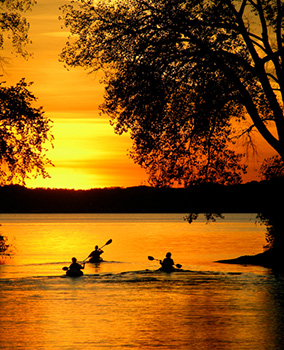 Kayakers at sunset